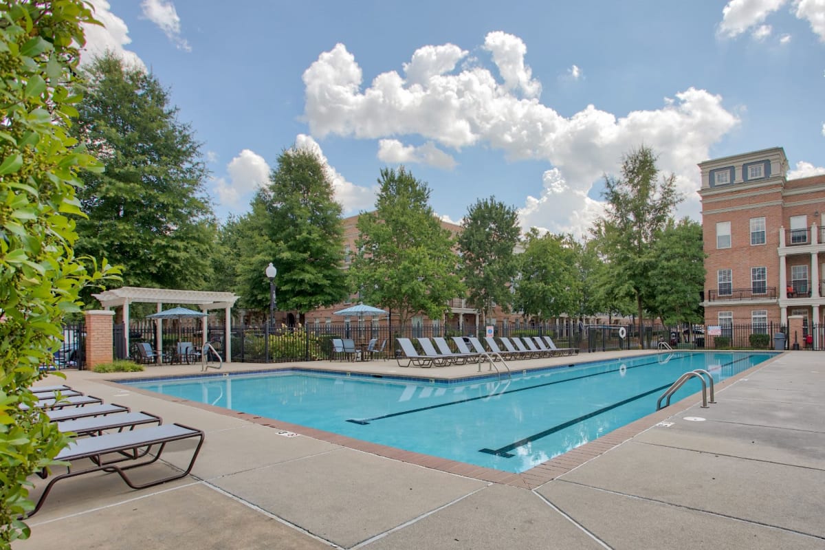 In Charlotte, North Carolina at the pool with ample seating for residents at Worthington Apartments & Townhomes