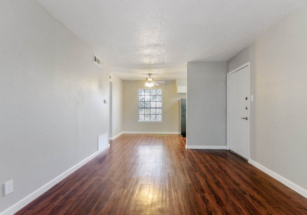 Living room with windows at 1000 Mary Apartment Homes in Iowa Park,Texas