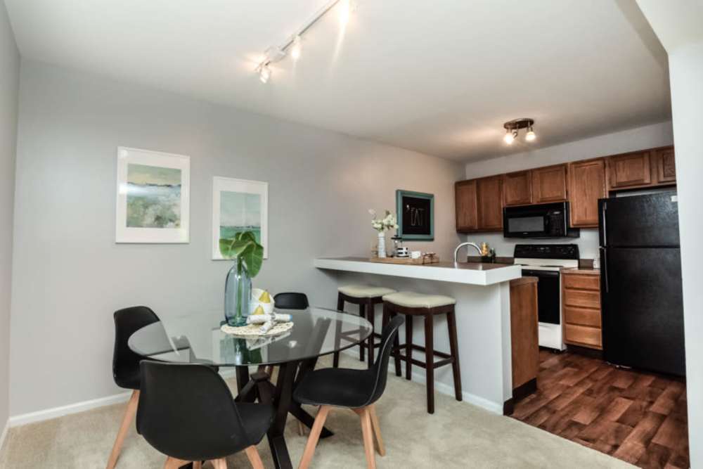 Dining area with access to kitchen at Bonhomme Village in Olivette. MO