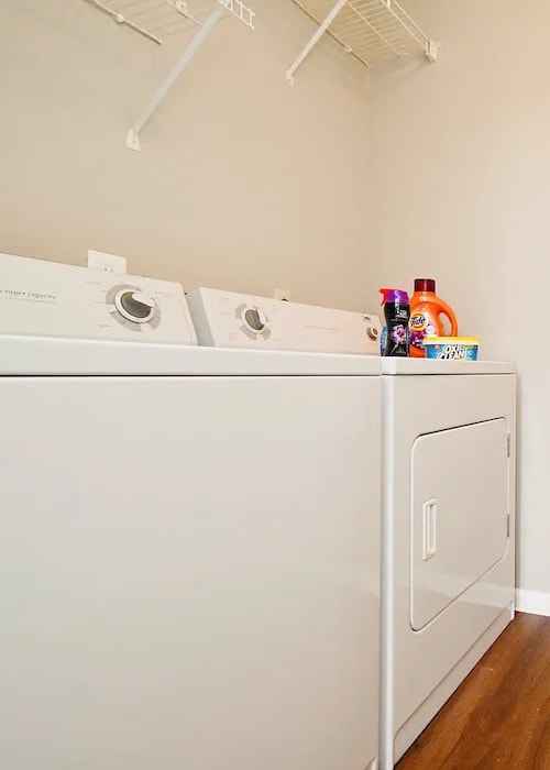 In-home washer and dryer at Woodspring Apartments in Florence, Kentucky