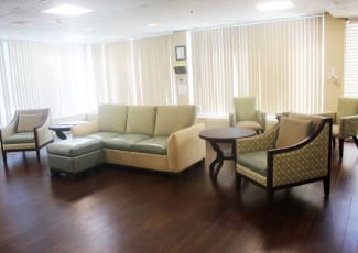 A large, comfortable seating area at Village Place Senior Living in Port Charlotte, Florida