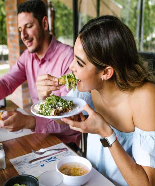 Friends having food near Lake Pointe Apartments in Madison, Wisconsin