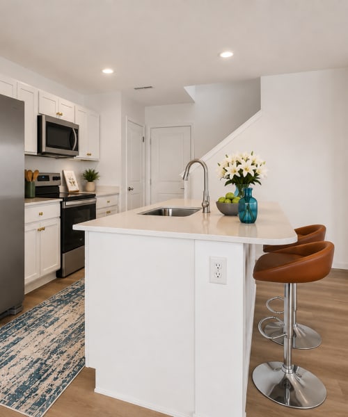 White kitchen cabinets and stainless steel appliances at Brixin Sonora in Fort Wayne, Indiana