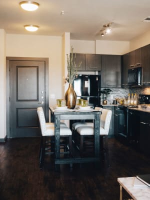 Model living room and kitchen with open space concept at Terra at University North Park in Norman, Oklahoma