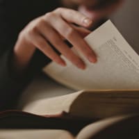 Student reading in a Campus Life & Style library