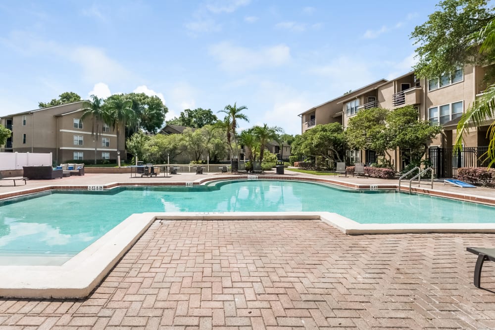 Resort-style swimming pool at Tuscany Pointe at Tampa Apartment Homes in Tampa, Florida