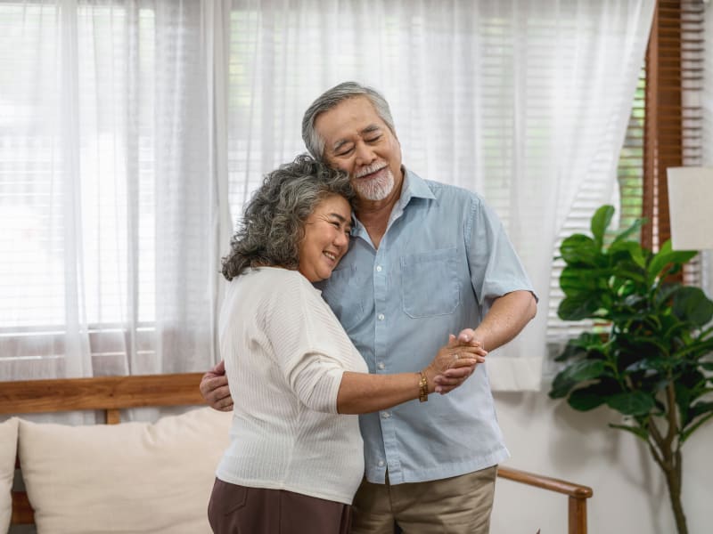 A resident couple dancing at Reflections at Garden Place in Columbia, Illinois. 