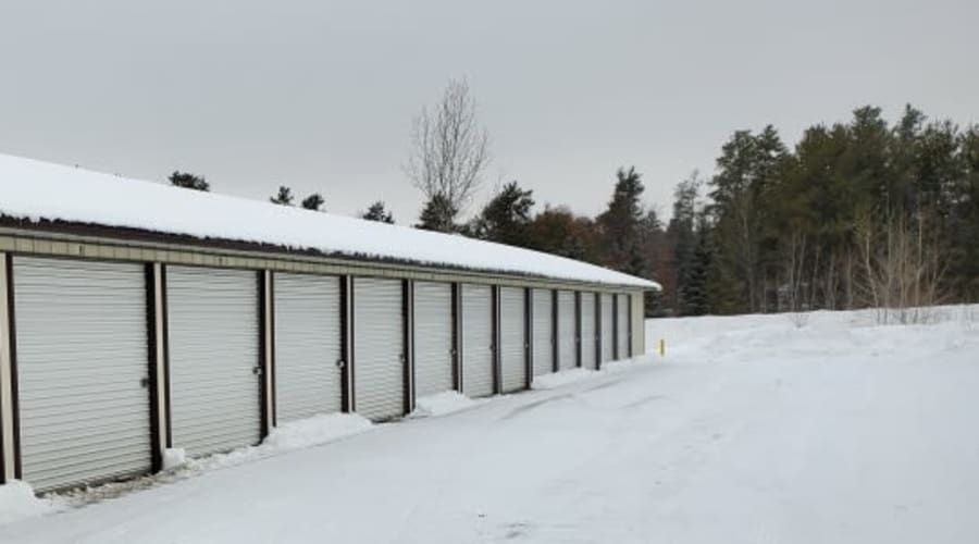 Storage units with white doors and locks at KO Storage of Baxter in Baxter, Minnesota