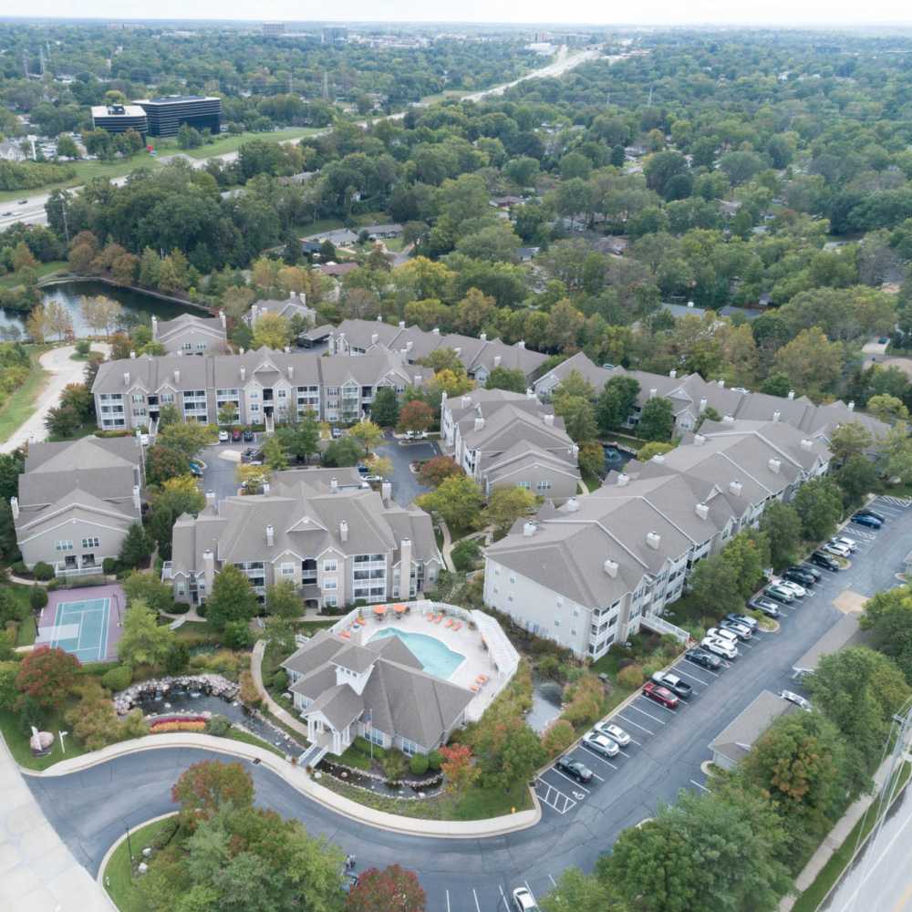 Charming community with lush landscaping and a sparkling water pool in Boulder Springs in Maryland Heights, Missouri.