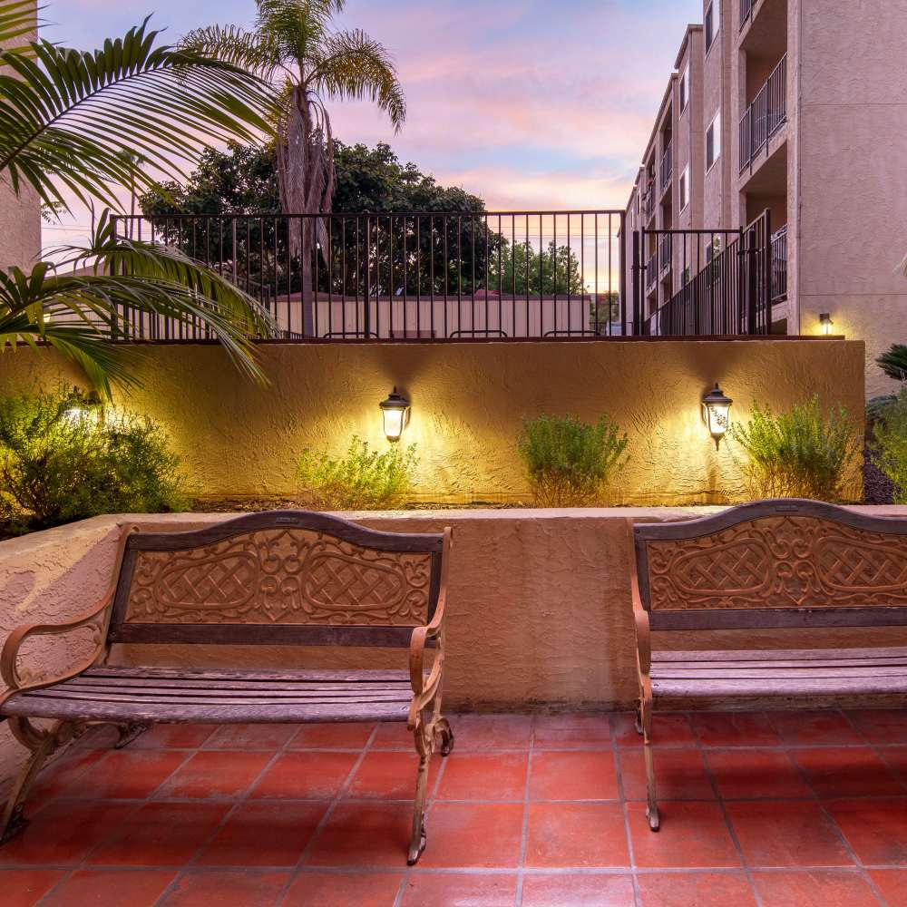 Patio seating area with lounge chairs at Hillcrest Summit in San Diego, California
