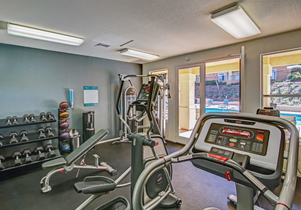 View of the pool area from the fitness center at Sofi Canyon Hills in San Diego, California