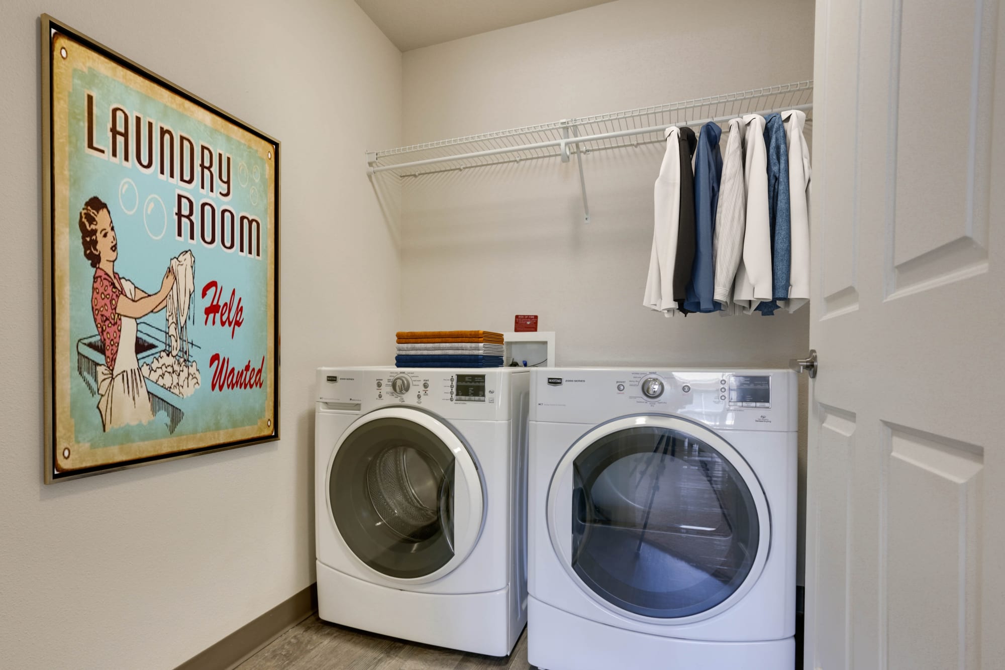 Side-by-side laundry machines at Terrene at the Grove in Wilsonville, Oregon
