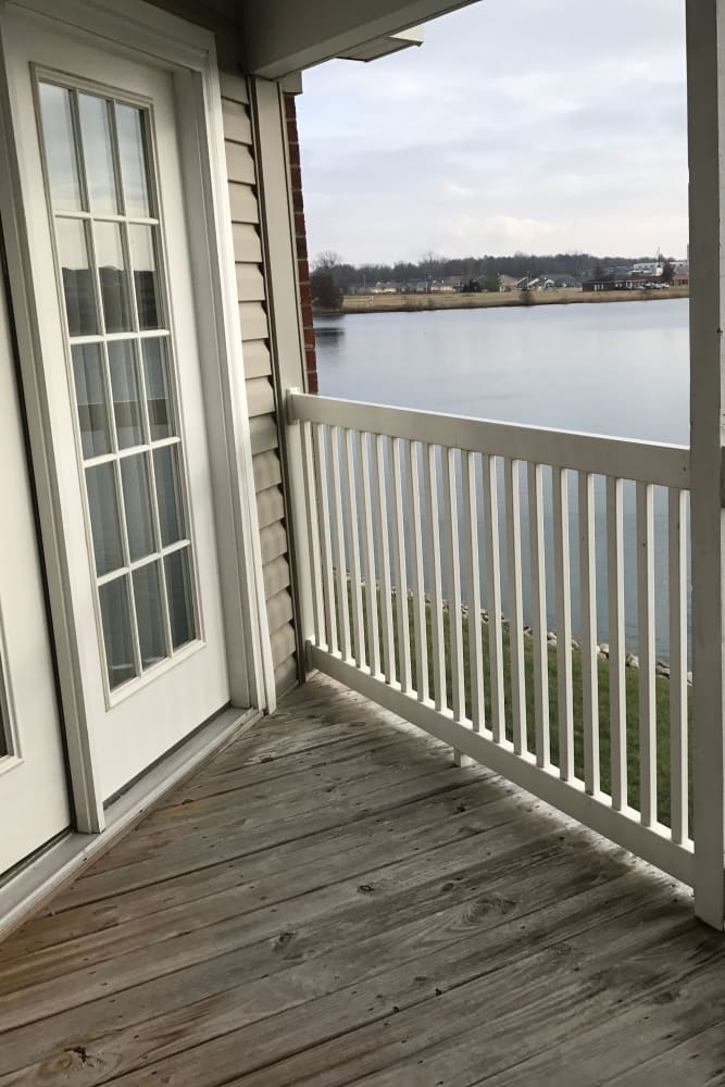 Resident private balcony with furnishings at Lakeshore Apartment Homes in Evansville, Indiana