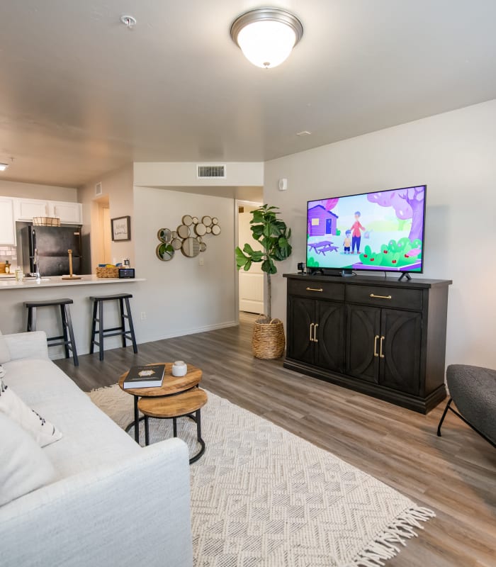 Carpeted living room and kitchen bar at Cross Timber in Oklahoma City, Oklahoma