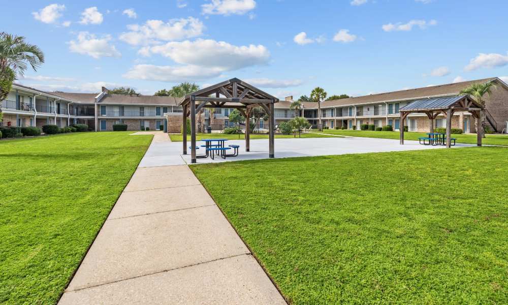 Outdoor seating and a lawn around at Falcon House in Fort Walton Beach,Florida