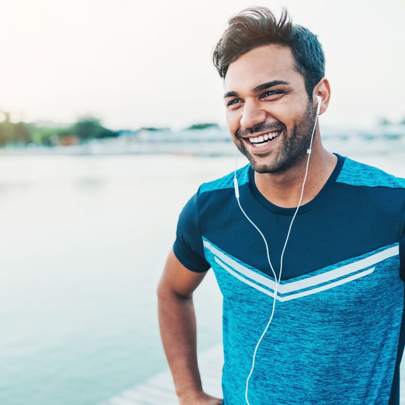 A resident enjoys a run near the water at East Beach Marina, Norfolk, Virginia