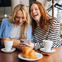 Resident friends out for a coffee at their favorite cafe near Green|House Short North in Columbus, Ohio