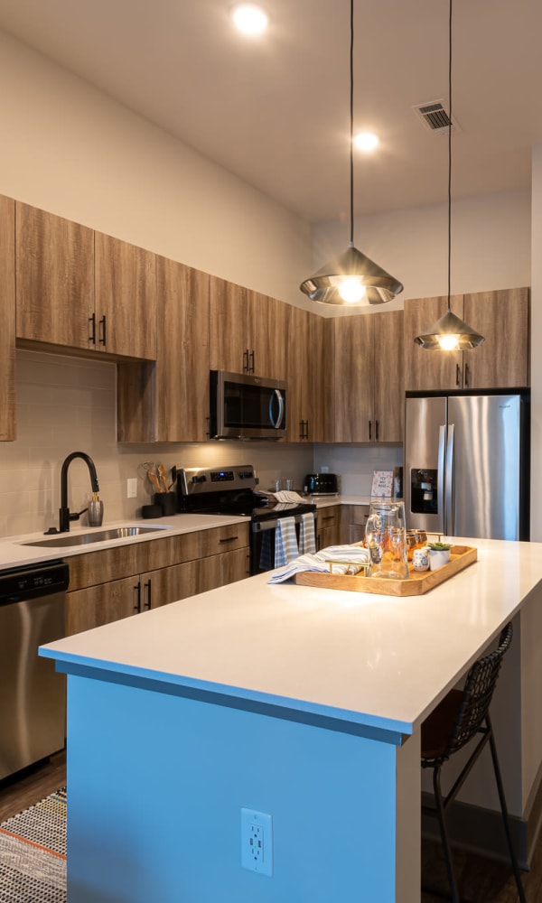 Stunning designer kitchen with stainless steel appliances at The Reserve at Patterson Place in Durham, North Carolina