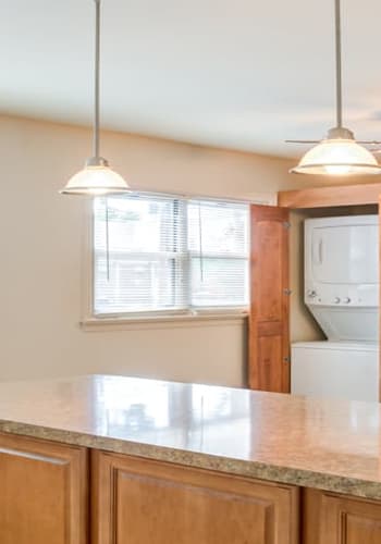 Airy floor plan with elegant counters and washer/dryer in back at Riverwood Commons in Bordentown, New Jersey