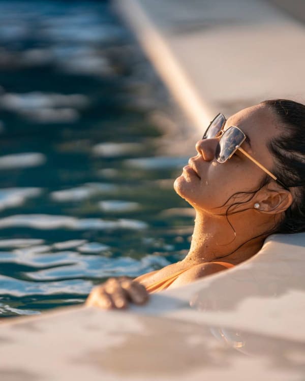 Resident relaxes in pool near Macland in Dallas, Georgia