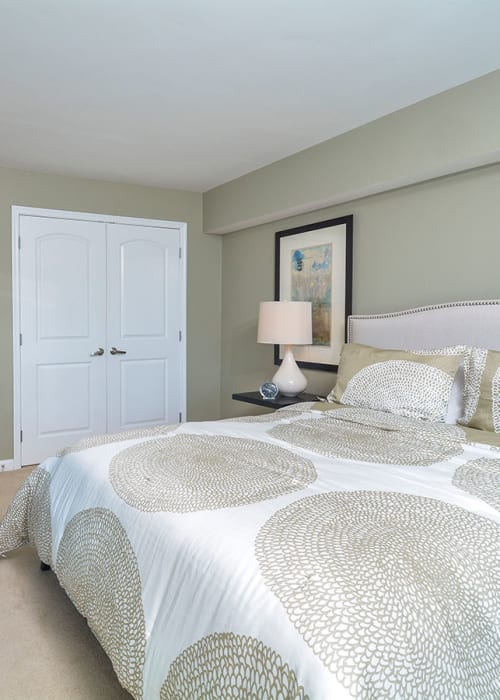 Cozy master bedroom at Cherry Hill Towers in Cherry Hill, New Jersey