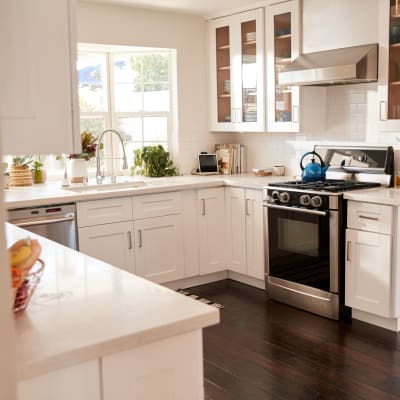Stainless steel appliances in a modern apartment kitchen at Mariposa at Clear Creek in Webster, Texas