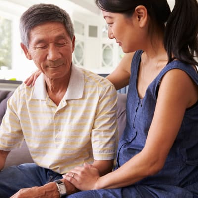 Resident talking with his adult daughter at Westminster Memory Care in Lexington, South Carolina