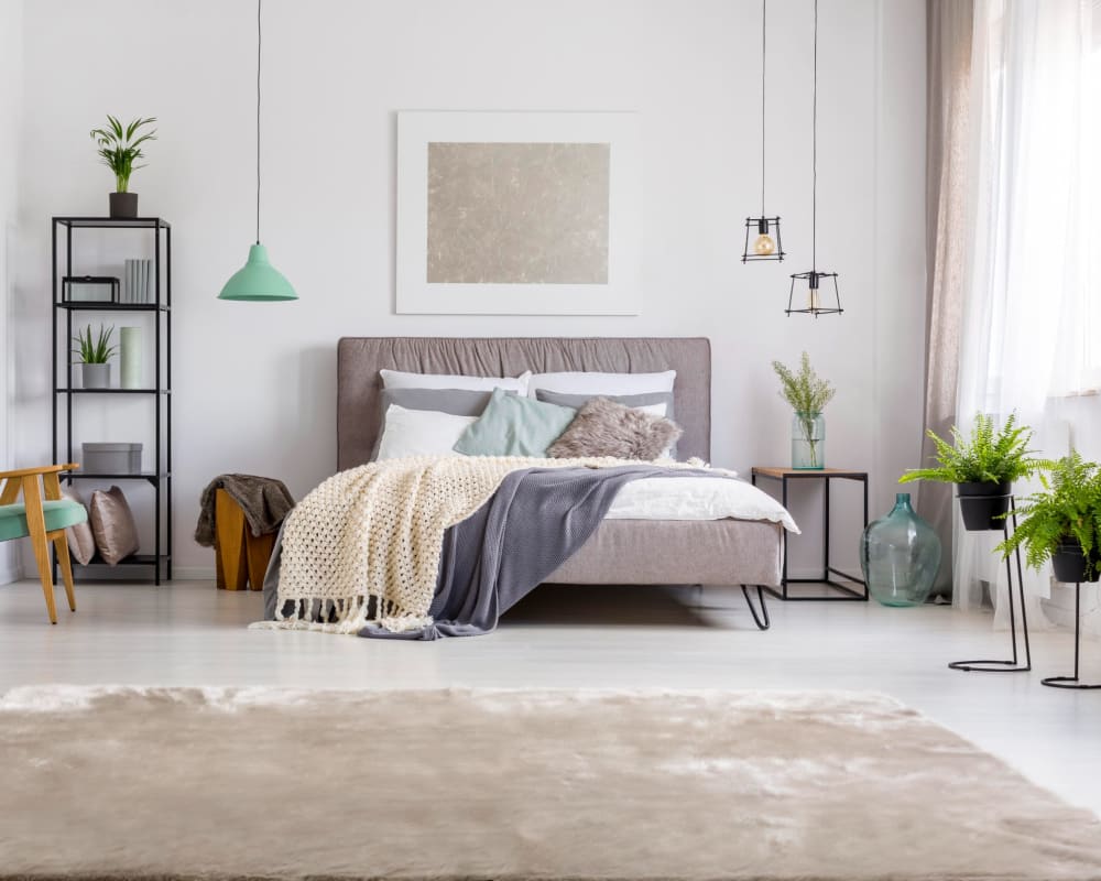 Well decorated bedroom at Clocktower Mill and Velvet Mill Apartments in Manchester, Connecticut