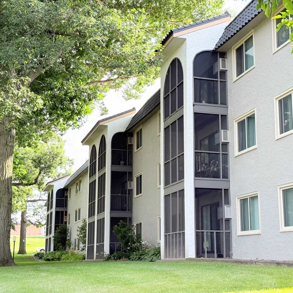 Lush green apartment exterior at Morada in Crystal, Minnesota