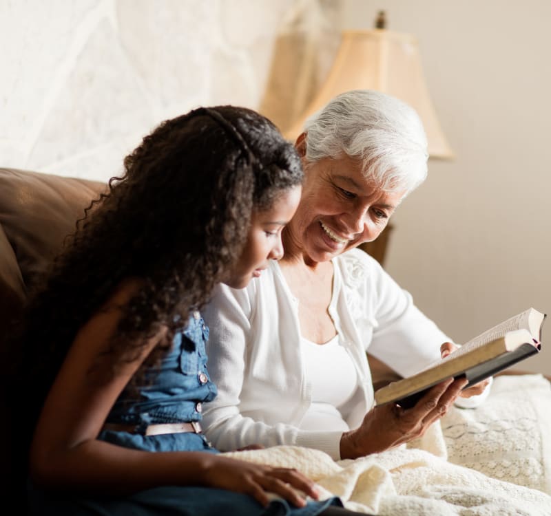 Residents looking at a photo album at Barclay House of Aiken in Aiken, South Carolina