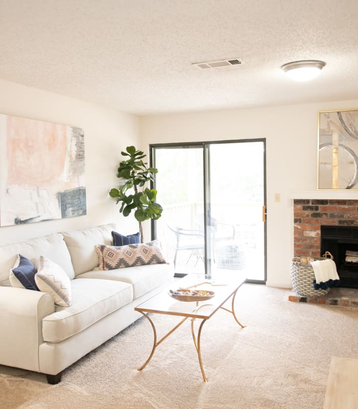 Spacious living room with large windows at The Mark Apartments in Ridgeland, Mississippi