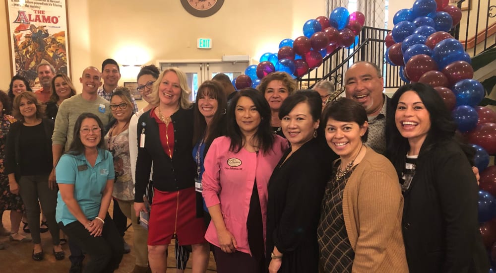 A group of staff pose for a picture at The Lakes at Banning in Banning, California. 