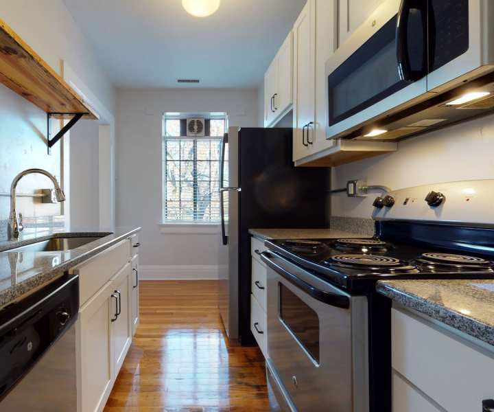 Stainless steel appliances in a modern apartment home at Historic Boylan Apartments in Raleigh, North Carolina