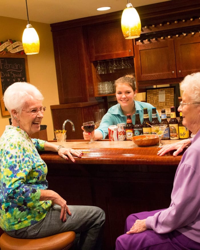Two residents enjoying drinks at Fancho's at The Springs at Clackamas Woods in Milwaukie, Oregon