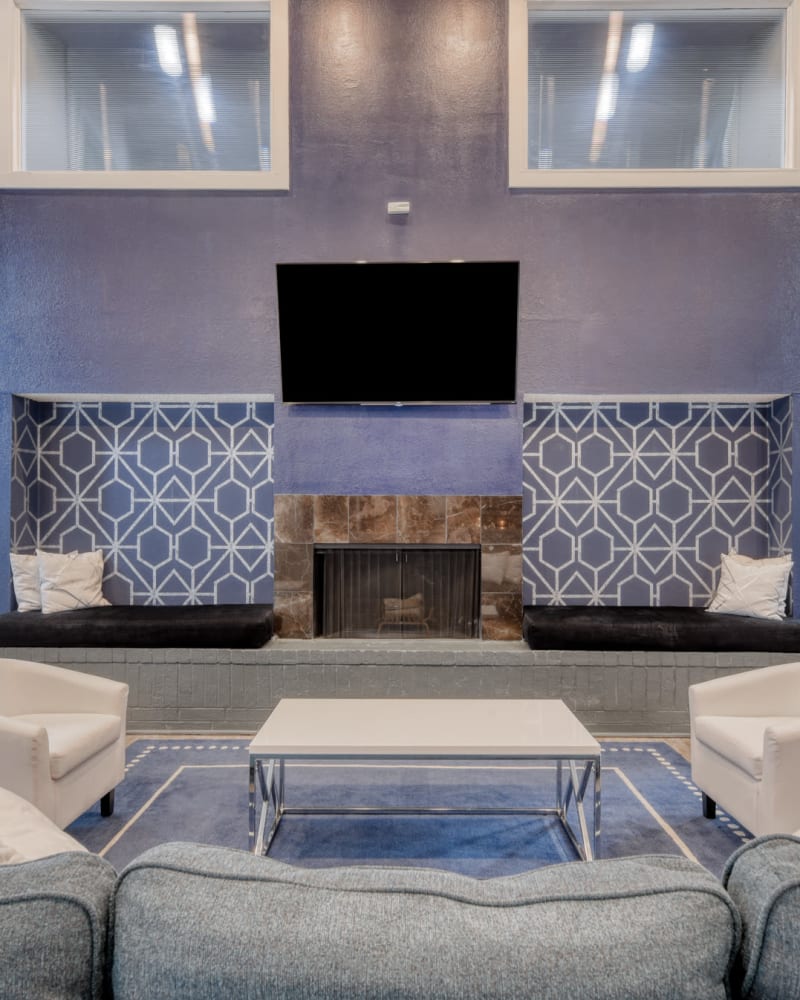 Seating around the fireplace in the clubhouse at Villas de Santa Fe in San Antonio, Texas