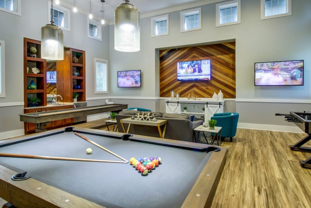Resident clubhouse lounge and pool table at Seagrass Apartments in Jacksonville, Florida
