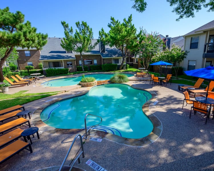 Gorgeous swimming pool area on a beautiful day at Ridgeview Place in Irving, Texas