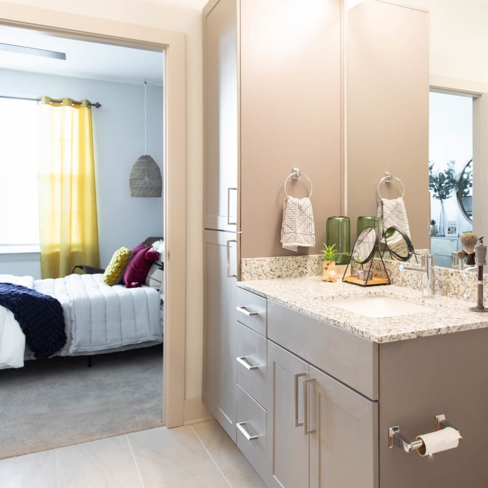 A bathroom attached to a main bedroom with storage space at Foundry Yards in Birmingham, Alabama