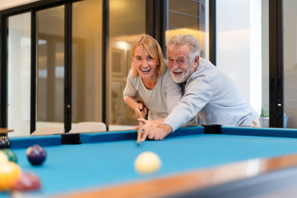 Couple playing pool at The Pinnacle in Plymouth Meeting, Pennsylvania