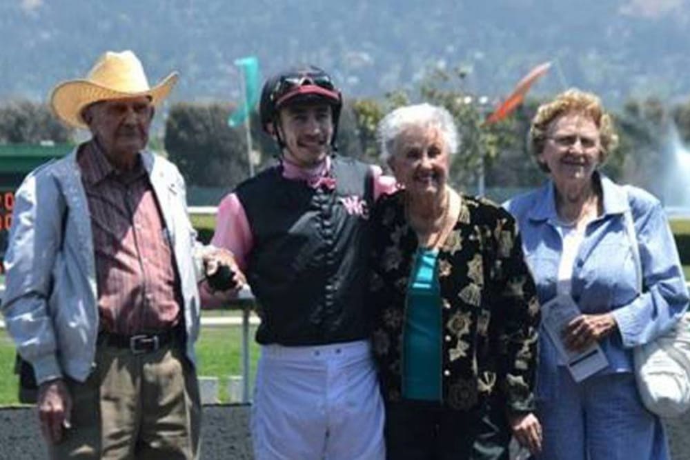 Photo with a jockey our at the horse races near Roseville Commons Senior Living in Roseville, California
