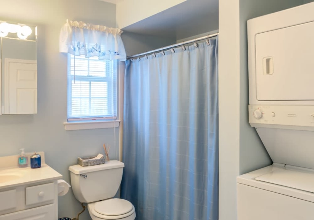 Bathroom with washer and dryer at Park Apartments in Bordentown, New Jersey