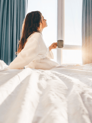 Resident with a cup of coffee at The Abbey at Dominion Crossing in San Antonio, Texas