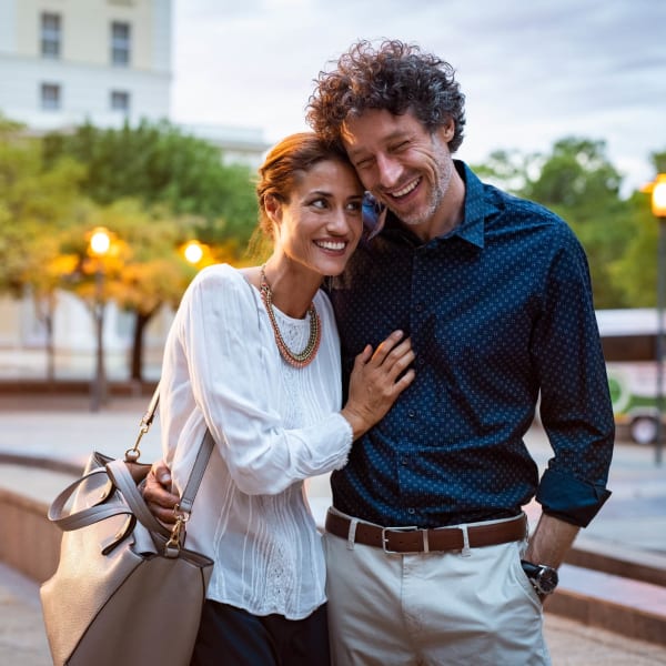 A happy couple out walking at El Potrero Apartments in Bakersfield, California