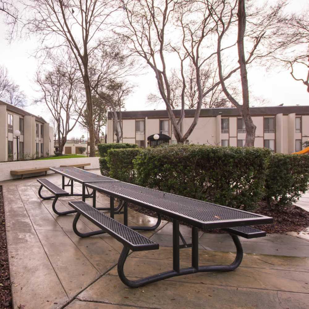 Charming community with seating space at Lawrence Road Apartments in Santa Clara, California,