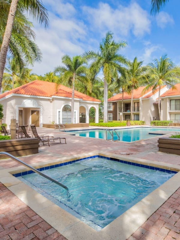 Resort-style swimming pool at Village Place Apartment Homes in West Palm Beach, Florida