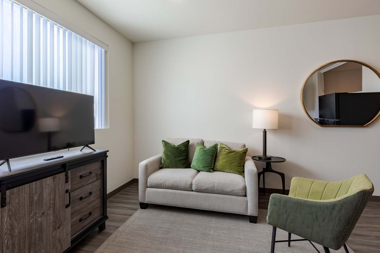 Living Room with couch and TV at Sable Station in Aurora, Colorado