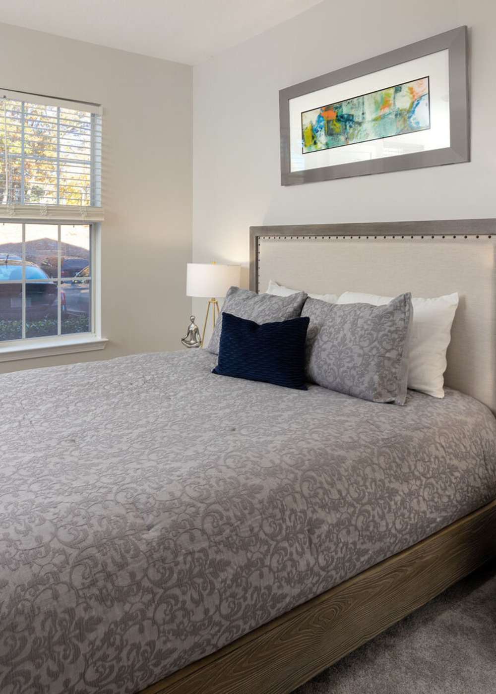 Spacious bedroom with large comfortable bed at Legacy Ridge in Atlanta, Georgia