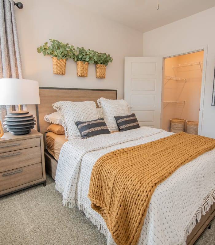 Bedroom with a walk-in closet at Adirondack in Independence, Missouri