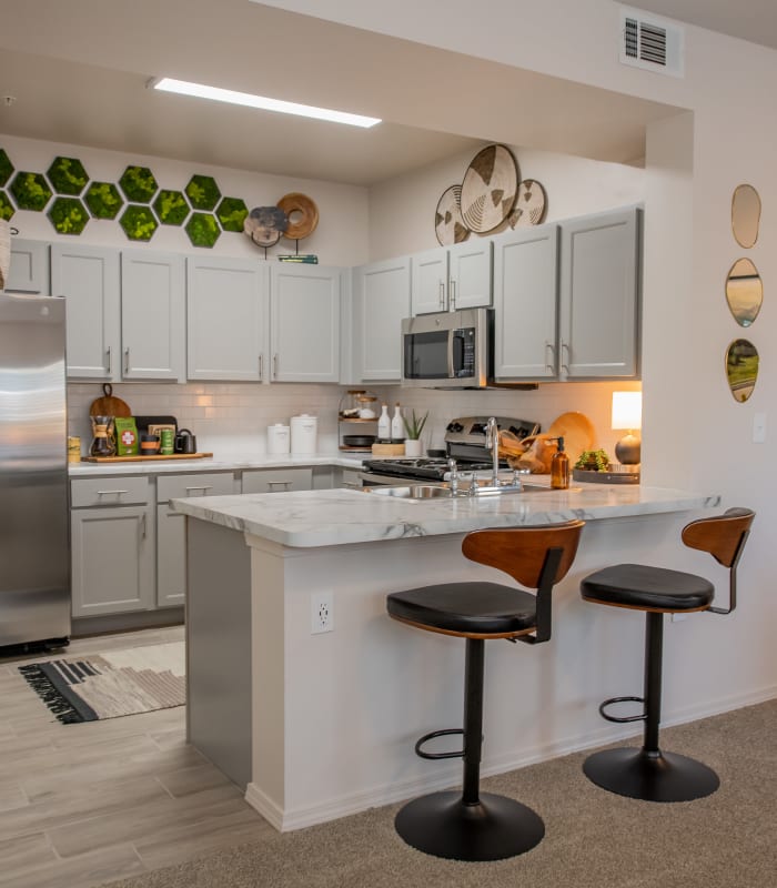 Kitchen with counter seating at Ridge at 66 in Yukon, Oklahoma