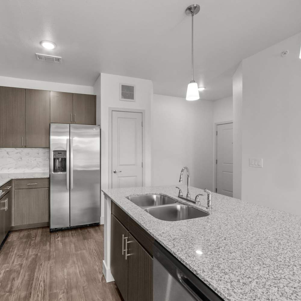 Open kitchen with wood flooring at Brook Hollow in Wichita Falls, Texas